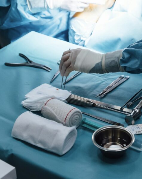 Anonymous nurse preparing equipment for the surgery