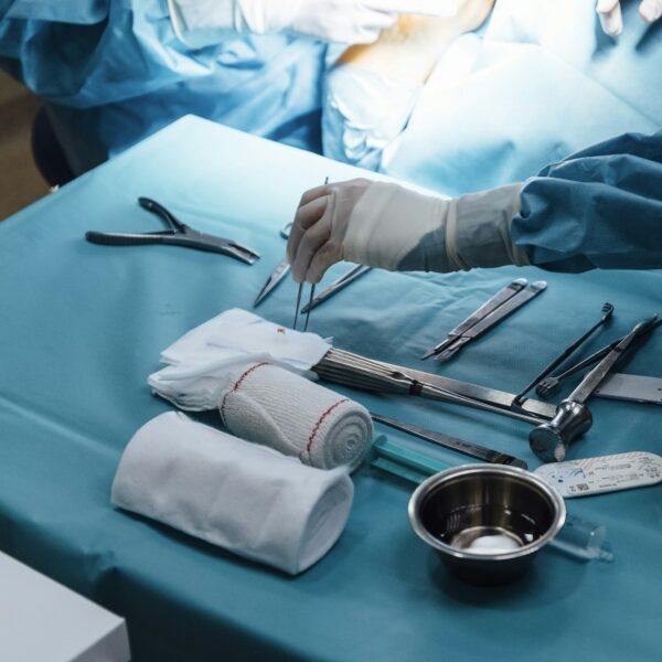 Anonymous nurse preparing equipment for the surgery