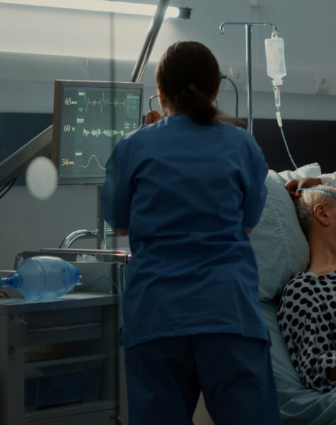 Nurse and african american medic using oxygen tube