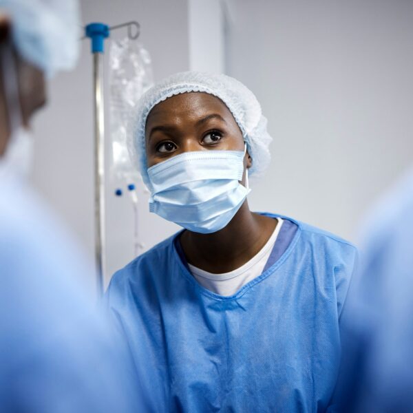 Surgery, teamwork or surgeons with mask for emergency, accident or healthcare in hospital clinic. D